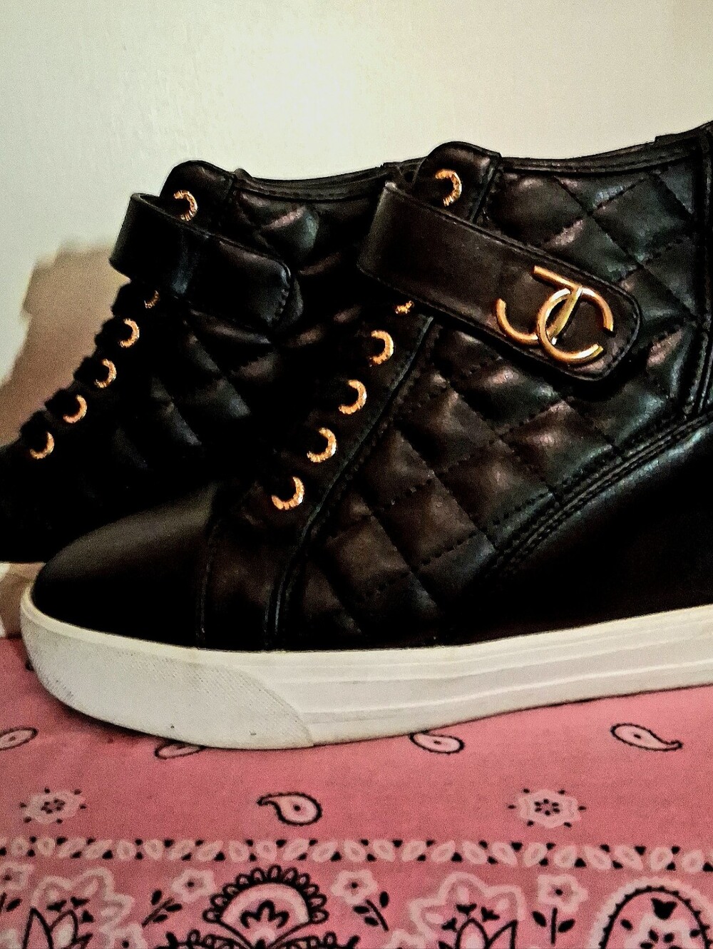Juicy Couture Black Quilted High-Top Wedges with Gold Accents